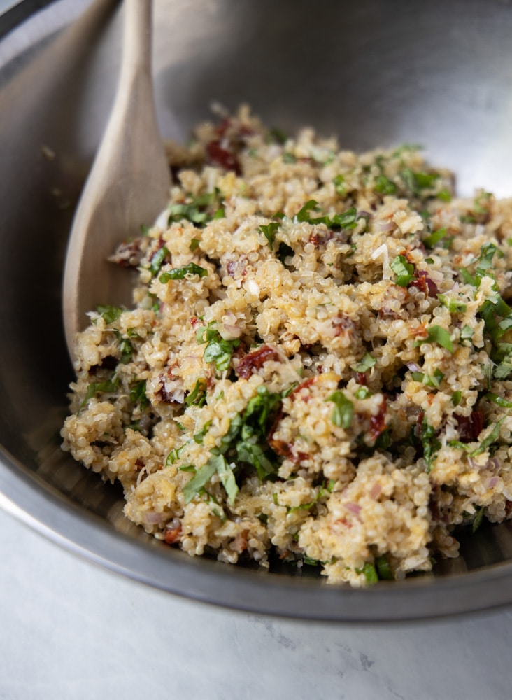 sundried tomato and basil quinoa patty mixture in a mixing bowl.