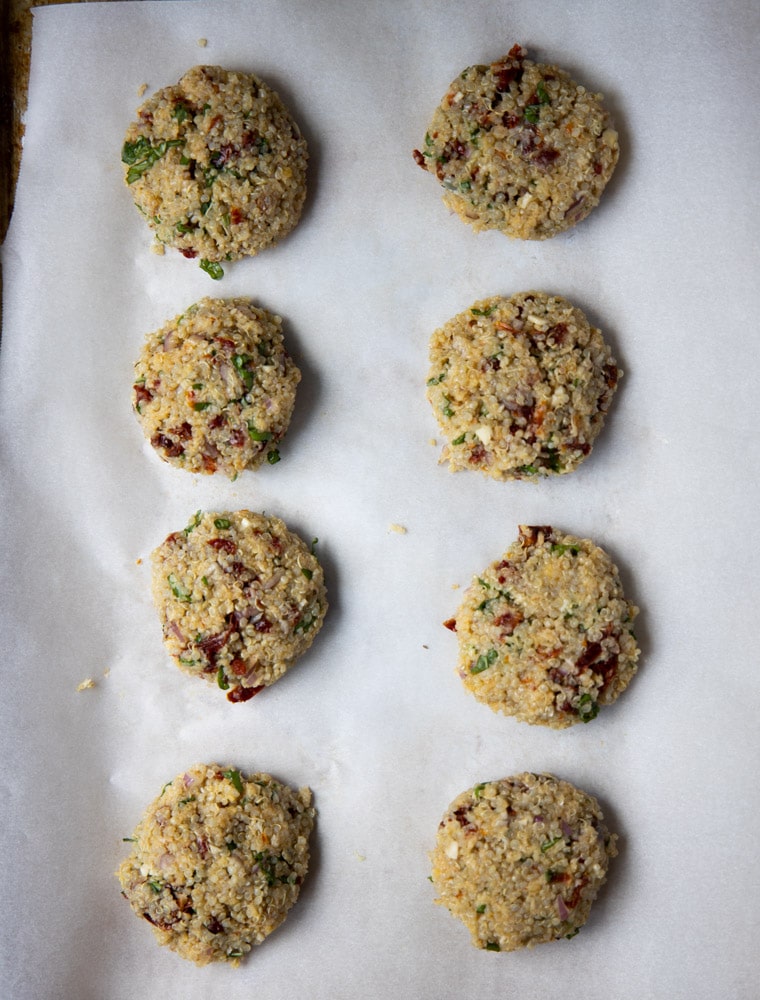 quinoa patties on a cookie sheet