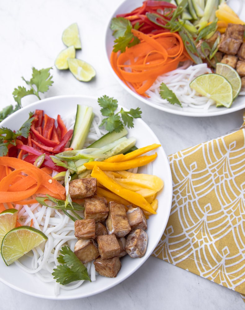 two bowls with spring roll bowl assembled in them