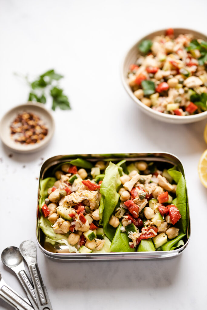 Tuna salad in lettuce wraps in a metal bento box.