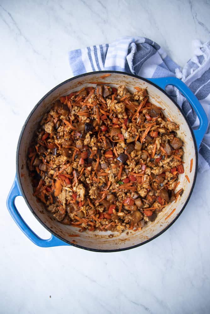 skillet filled with the cooked chicken and veggie mixture 