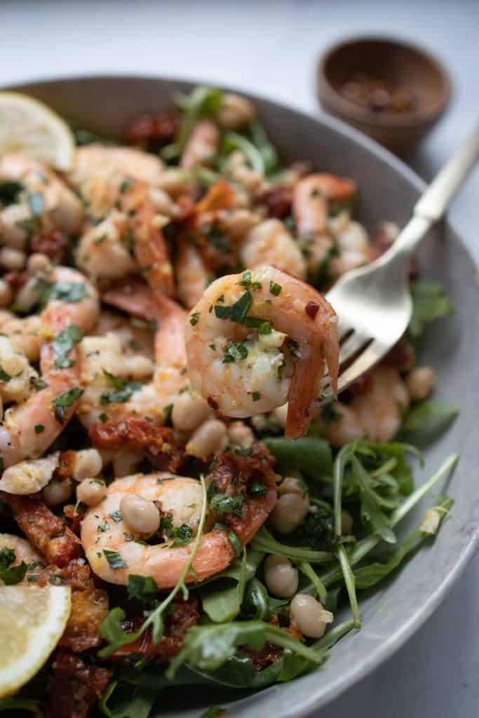 https://www.simplespoonfuls.com/wp-content/uploads/2021/01/mediterranean-shrimp-salad-bite-shot-683x1024.jpg