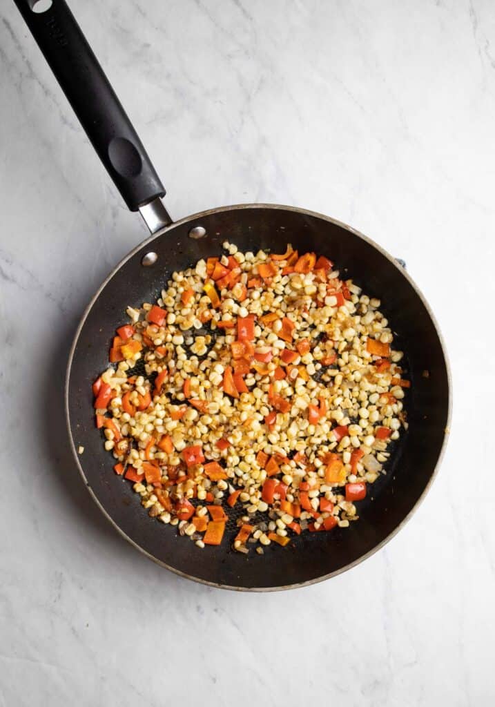 skillet of corn and red pepper salsa mix