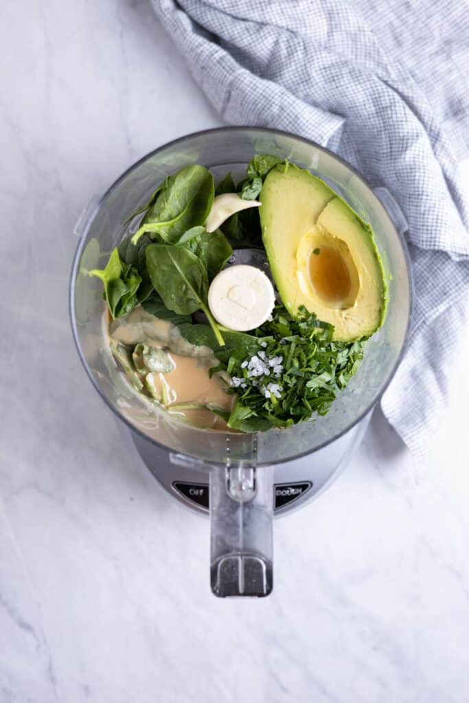 avocado tahini sauce ingredients in a food processor