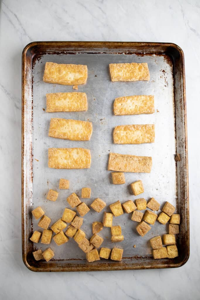 crispy tofu baked on a cookie sheet