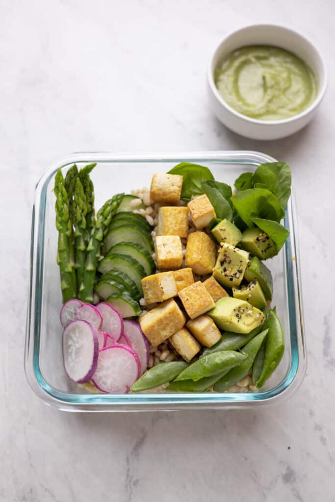 glass meal prep container with spring grain bowl