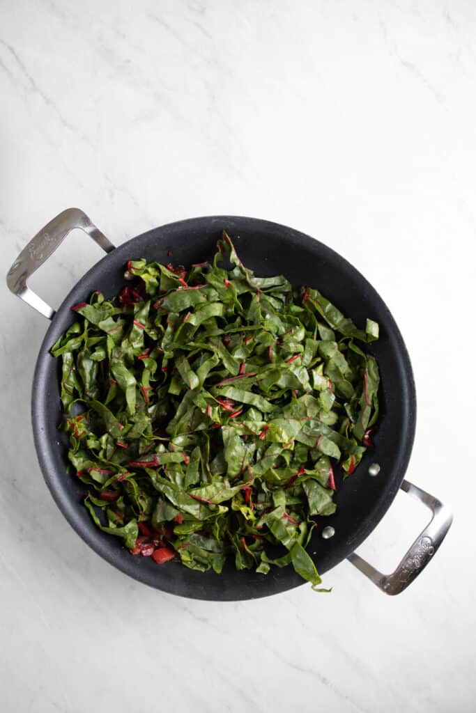 fresh Swiss chard leaves in a skillet