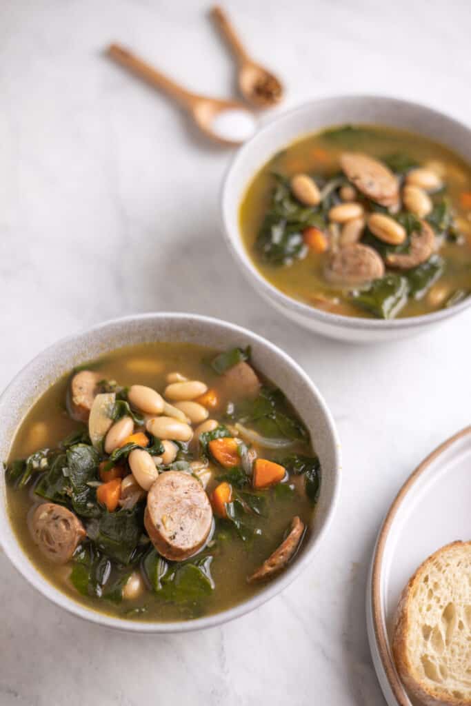 bowl of sausage, Swiss chard and white bean soup up close