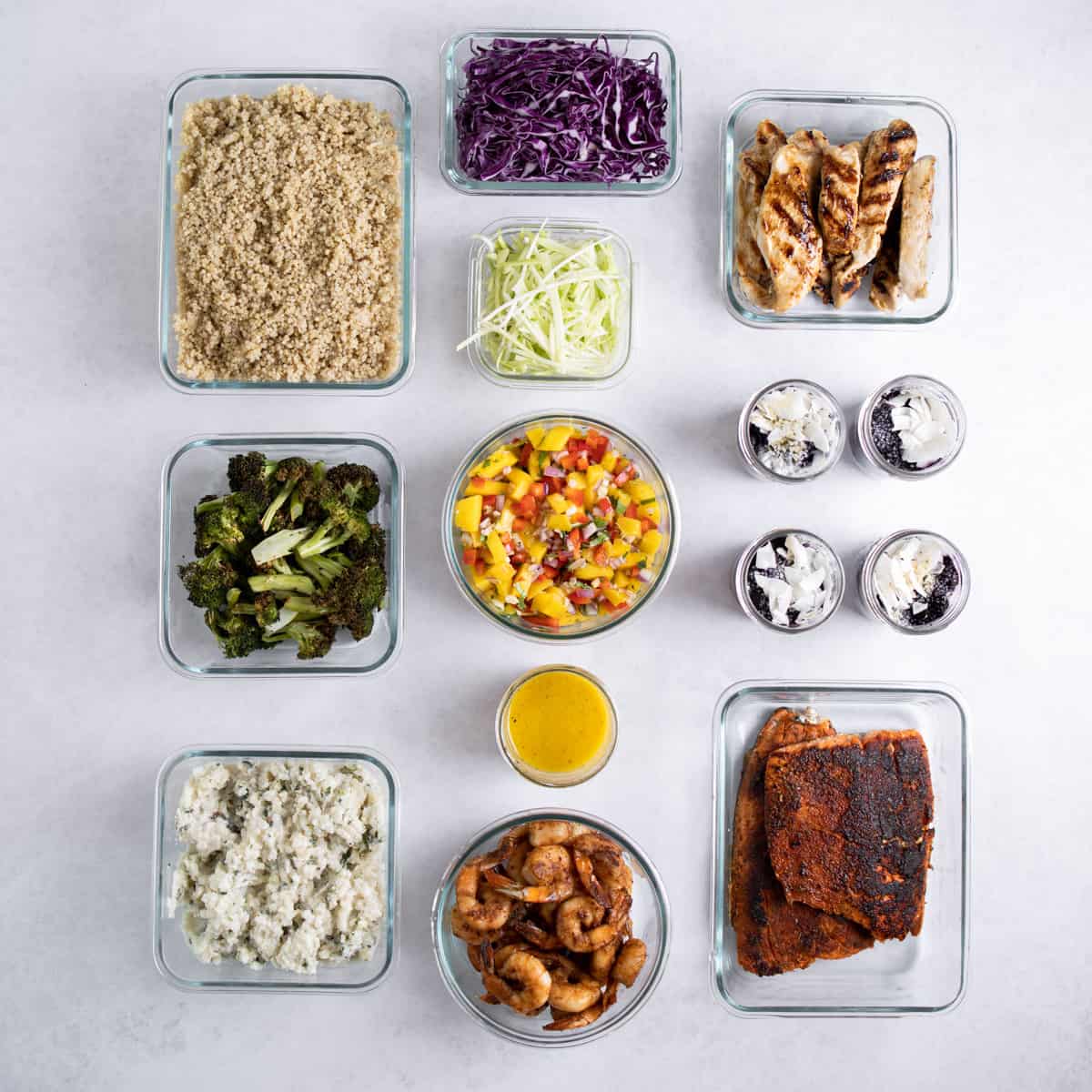 glass containers filled with meal prepped ingredients