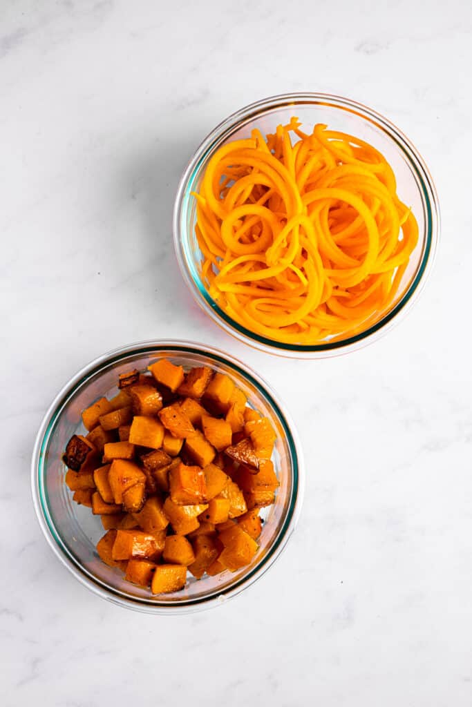 glass bowls filled with spiralized and roasted butternut squash