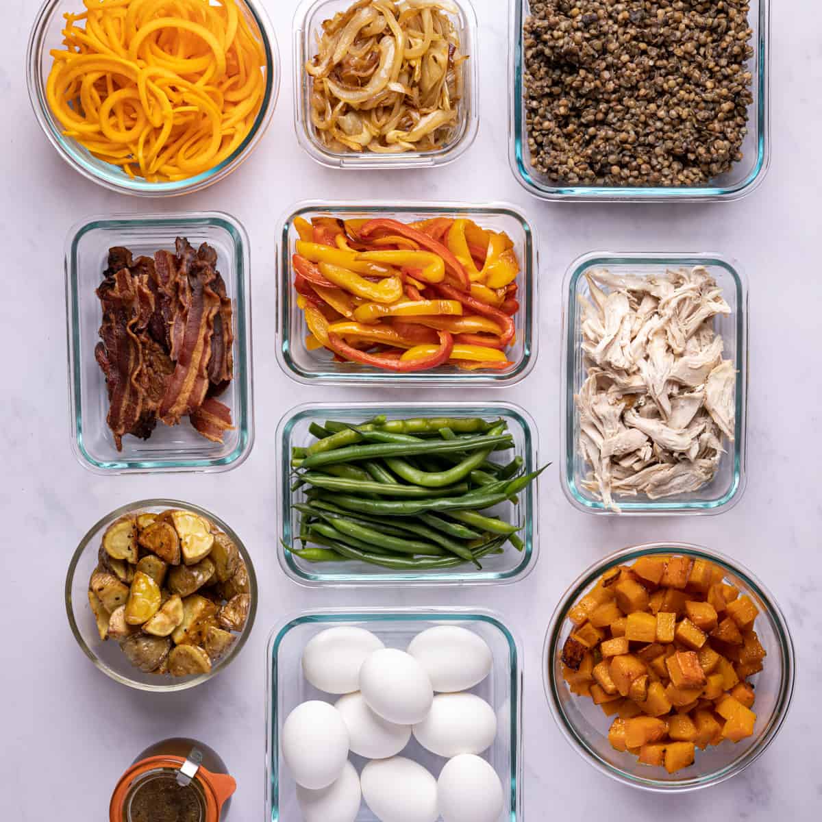 healthy fall meal prep ingredients in glass containers