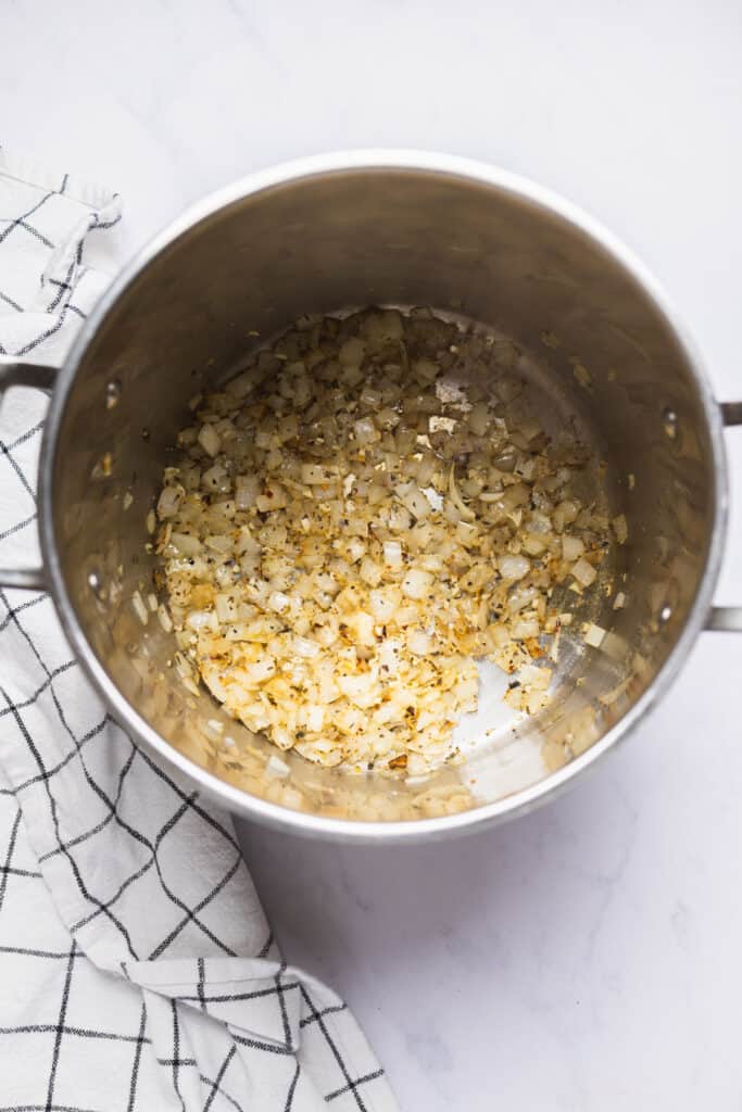 Sauteed onions and garlic in a pot.